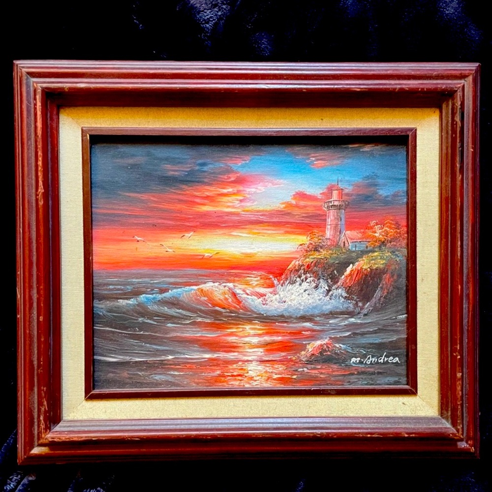 Framed lighthouse painting